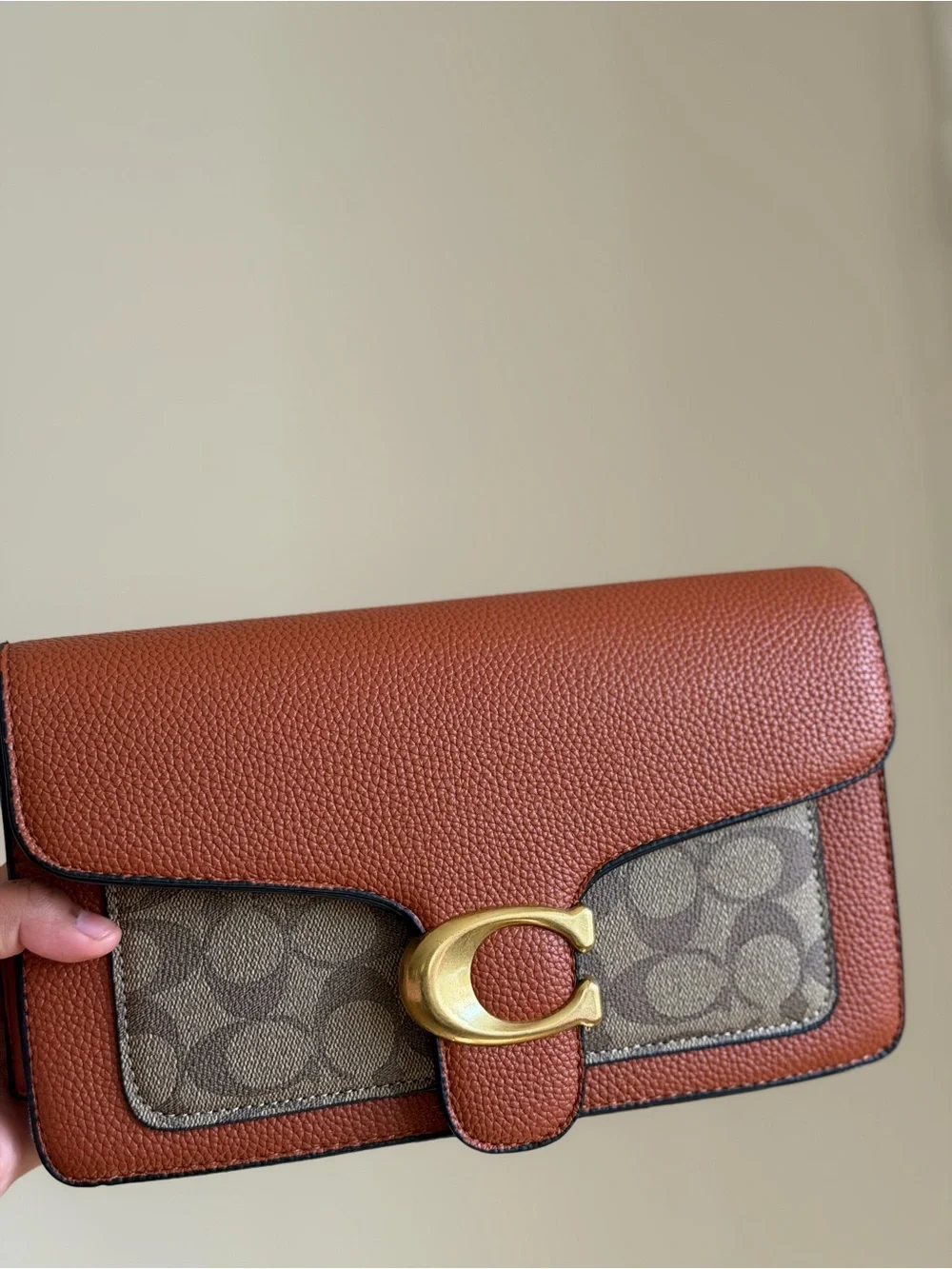 Brown Pebbled Leather Shoulder Bag with Signature Accent